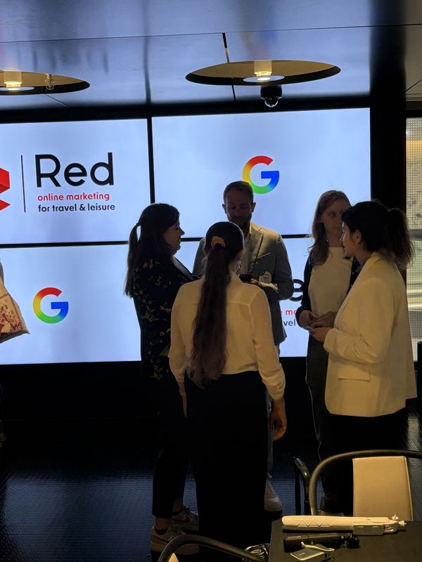 Marketers from attractions and leisure networking in front of the Red Online Marketing and Google screens at Google London